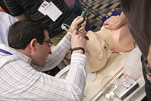 During the ATS Resident Boot Camp, which attracted 140 residents, participants practice hands-on skills.
