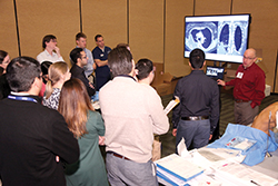 Residents practice hands-on skills at the Resident Boot Camp, attracting 152 incoming pulmonary and critical care fellows.