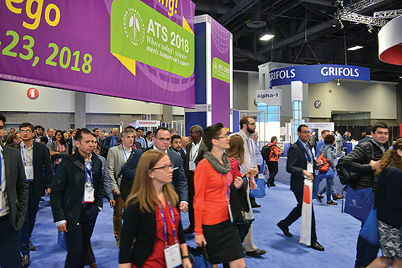 Attendees walking into the exhibit hall.